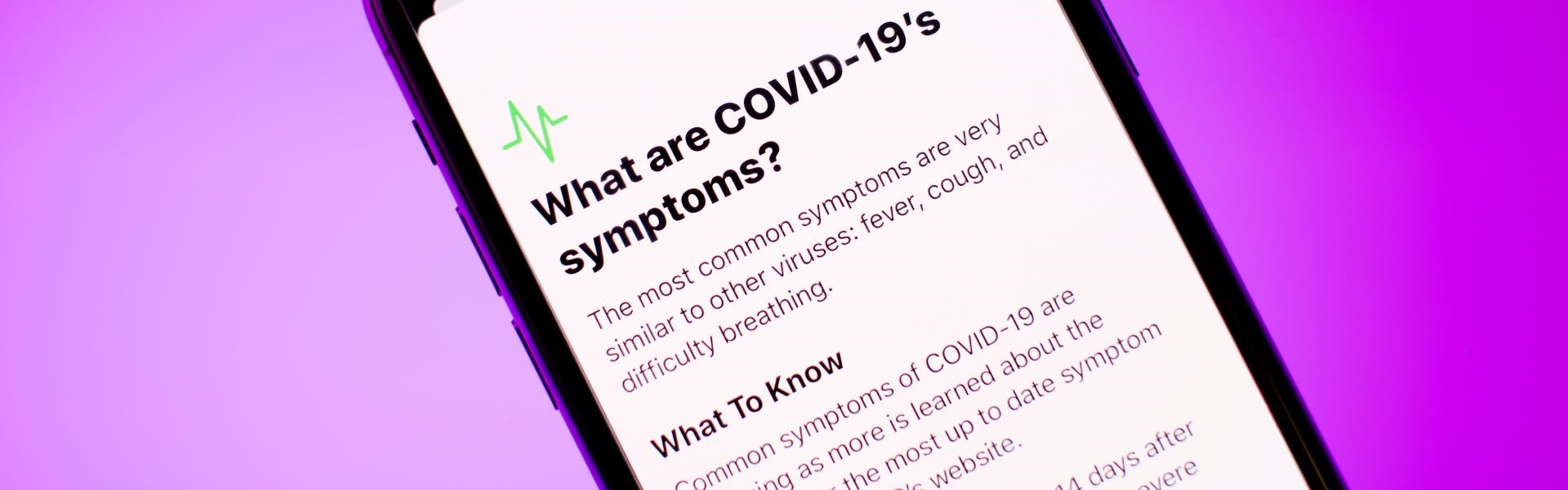 Phone with text on covid symptoms